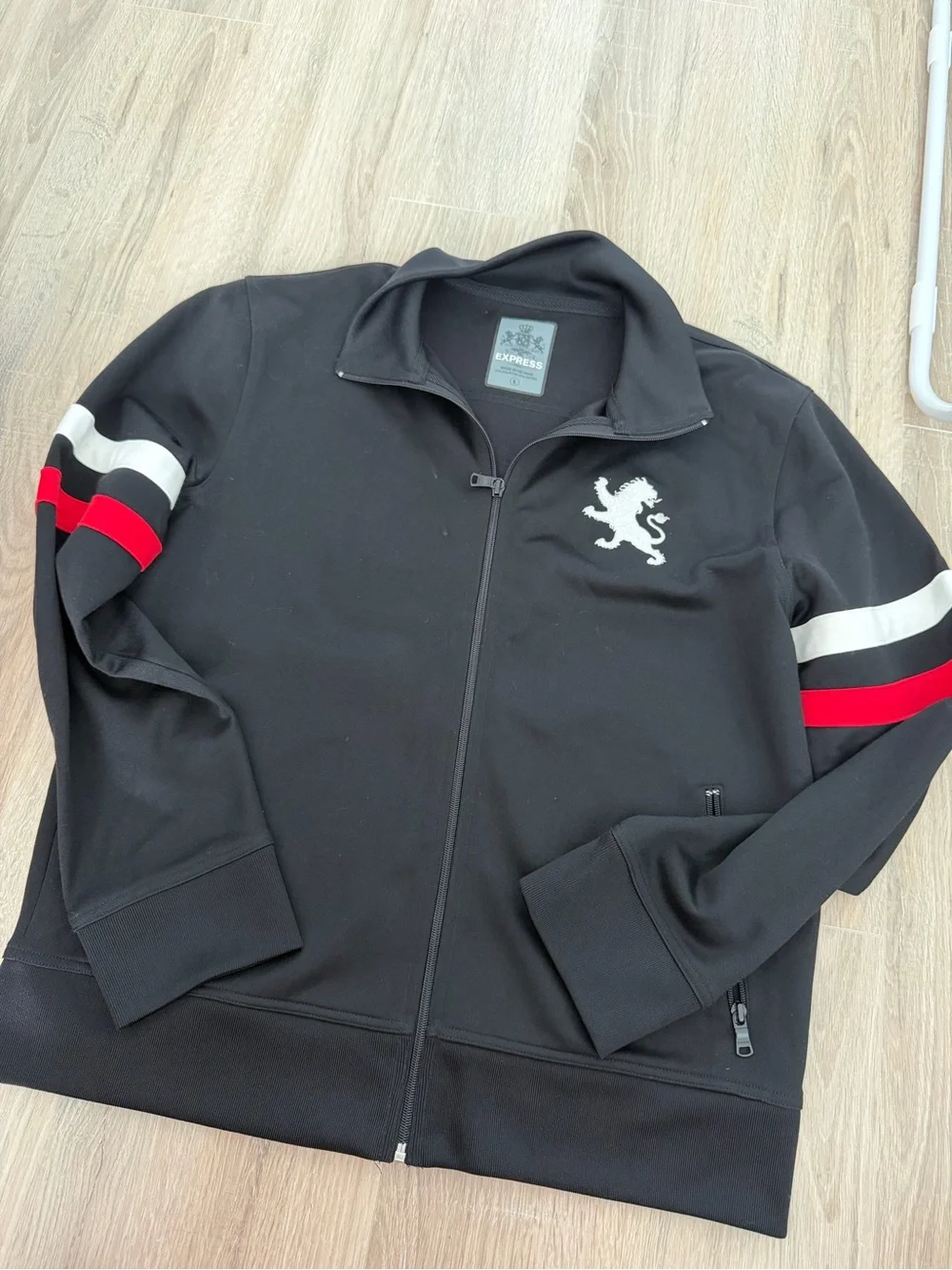 Express Black Track Jacket with Red and White Sleeve Stripes and Lion Logo